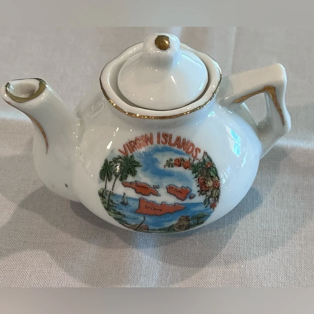 Miniature teapot, cup and saucer set